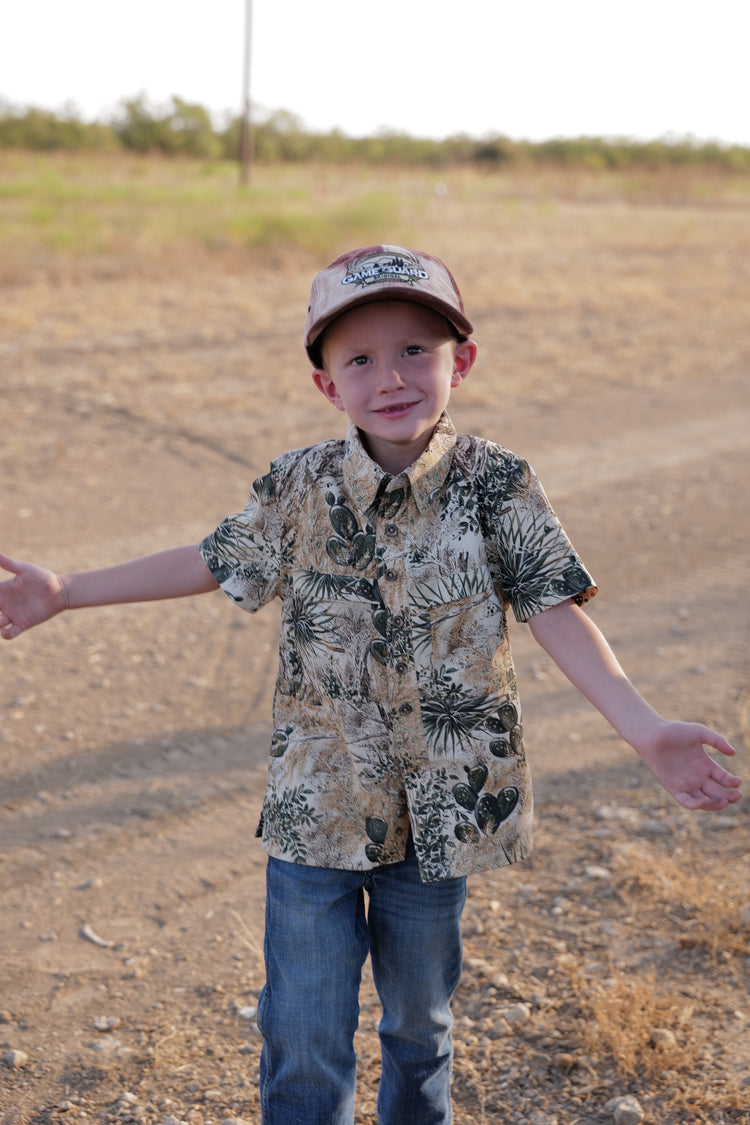 Boy holding arms out wearing GameGuard Youth MicroFiber Shirt