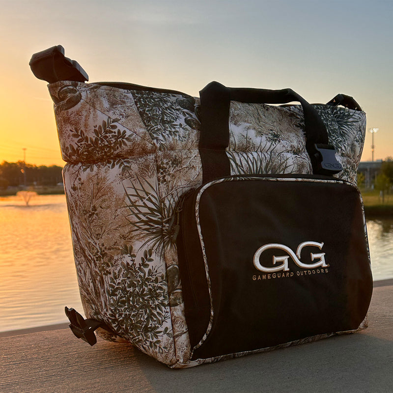 Load image into Gallery viewer, Caviar GameGuard Cooler sitting in front of a lake
