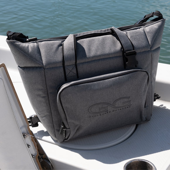 gray GunMetal Cooler Bag sitting on a boat in the sun keeping drinks and food cold